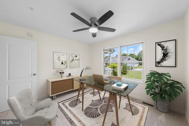 a work room with furniture and window