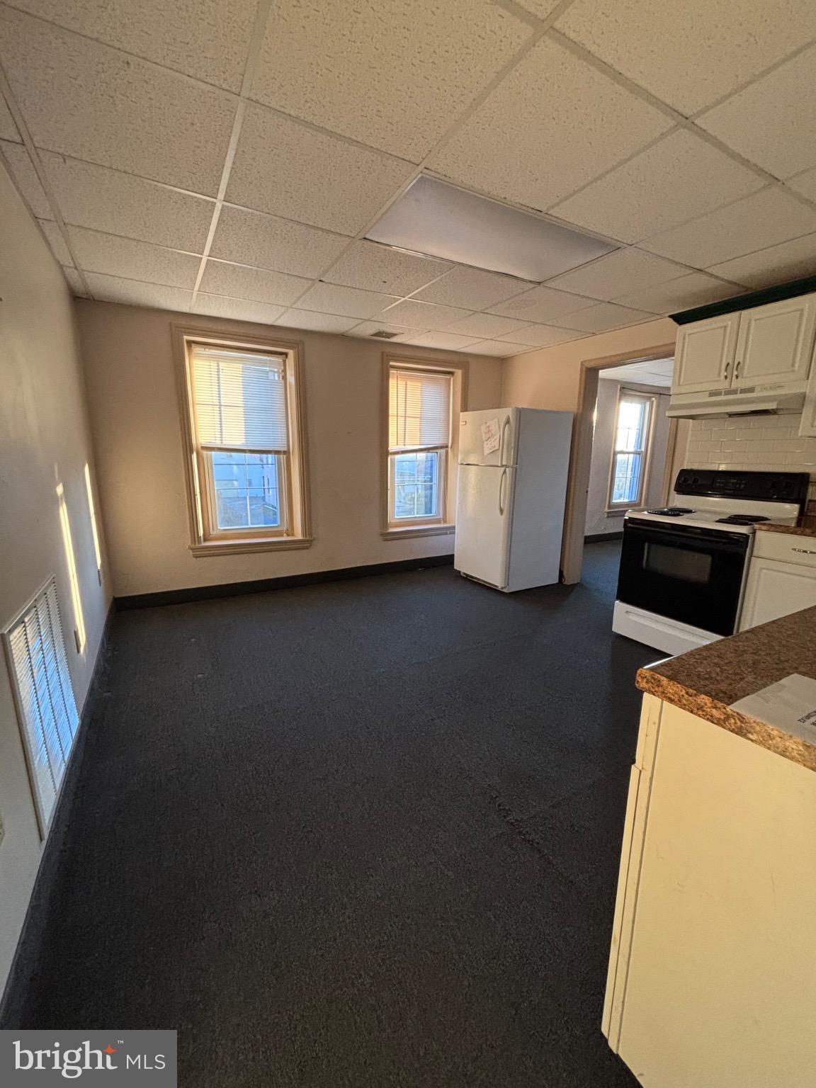 145 Main Street, Unit D Pennsburg, PA 18073 - Photo 6 of 8 a view of a kitchen with furniture and a window