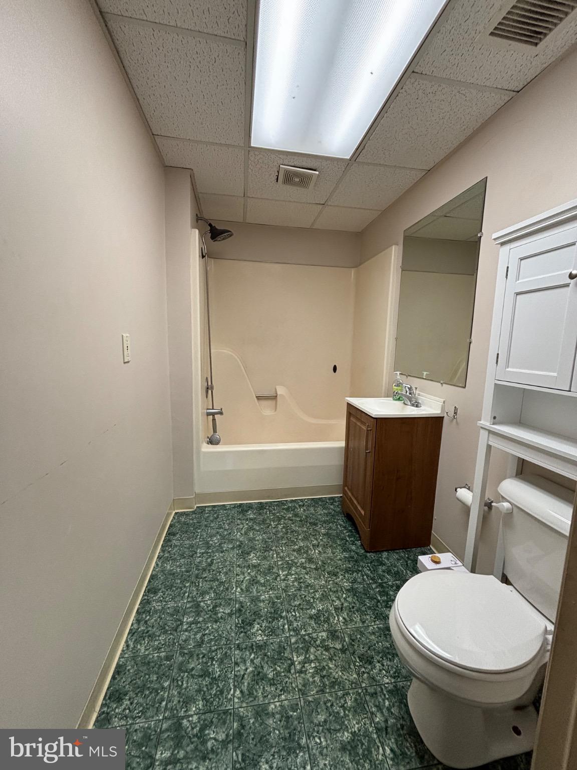 145 Main Street, Unit D Pennsburg, PA 18073 - Photo 7 of 8 a bathroom with a toilet a sink and bathtub