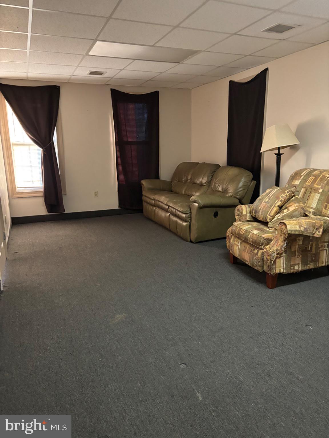 145 Main Street, Unit D Pennsburg, PA 18073 - Photo 8 of 8 a living room with furniture and a window