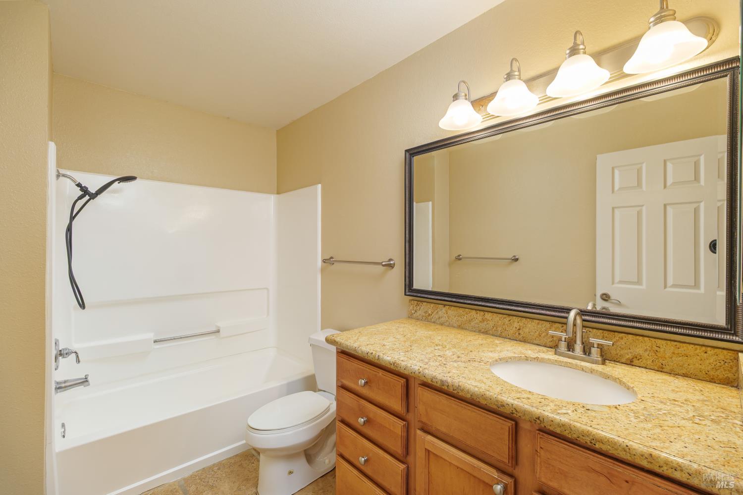 346 Eastridge Drive San Ramon, CA 94582 - Photo 11 of 21 a bathroom with a granite countertop sink toilet and shower