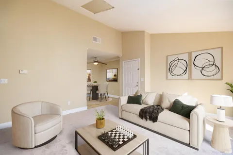 a living room with furniture and a rug