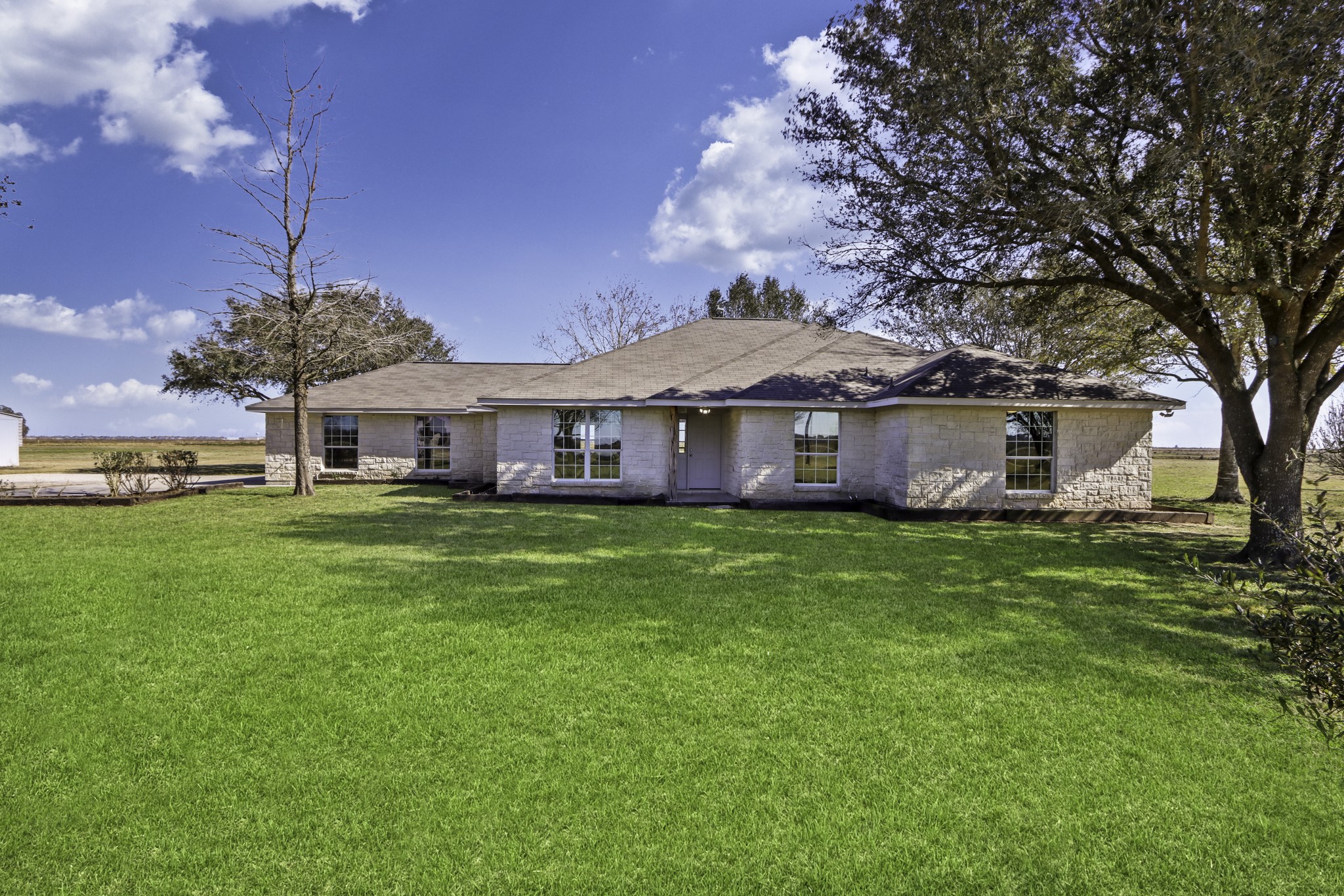 2445 Woods Road Brookshire, TX 77423 - Photo 1 of 29 a front view of a house with garden