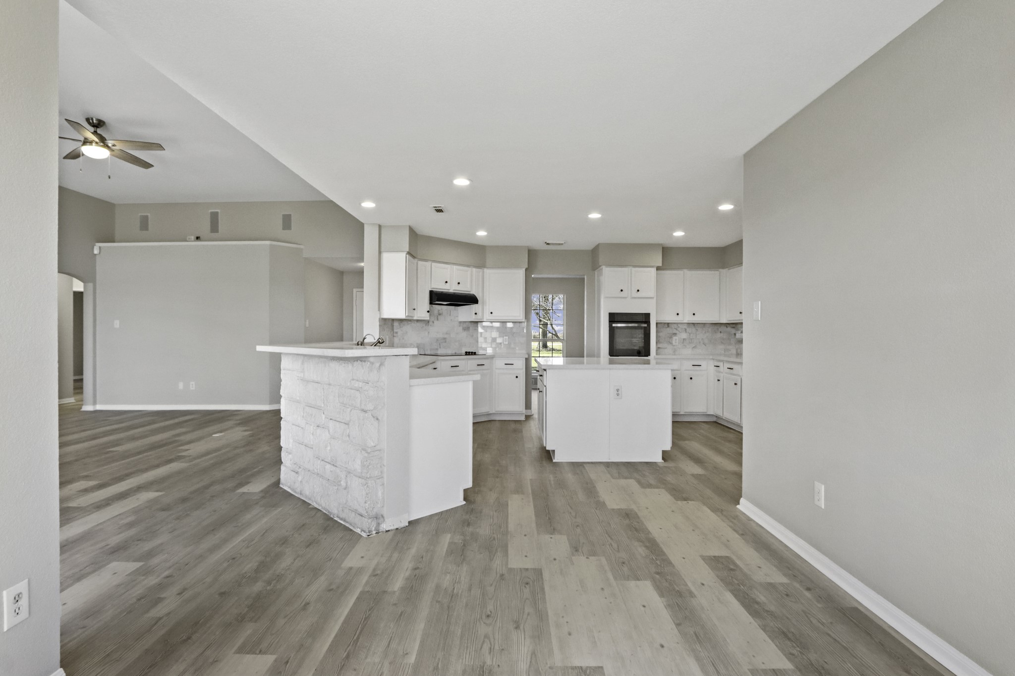 2445 Woods Road Brookshire, TX 77423 - Photo 11 of 29 a view of kitchen with kitchen island a sink wooden floor and a refrigerator
