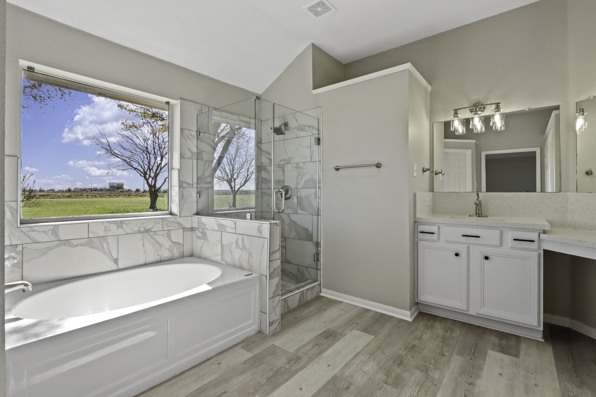 2445 Woods Road Brookshire, TX 77423 - Photo 14 of 29 a bathroom with a tub sink and mirror