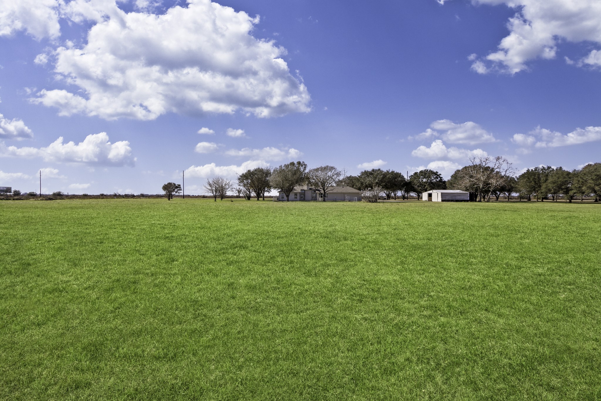 2445 Woods Road Brookshire, TX 77423 - Photo 22 of 29 a view of a golf course with the garden