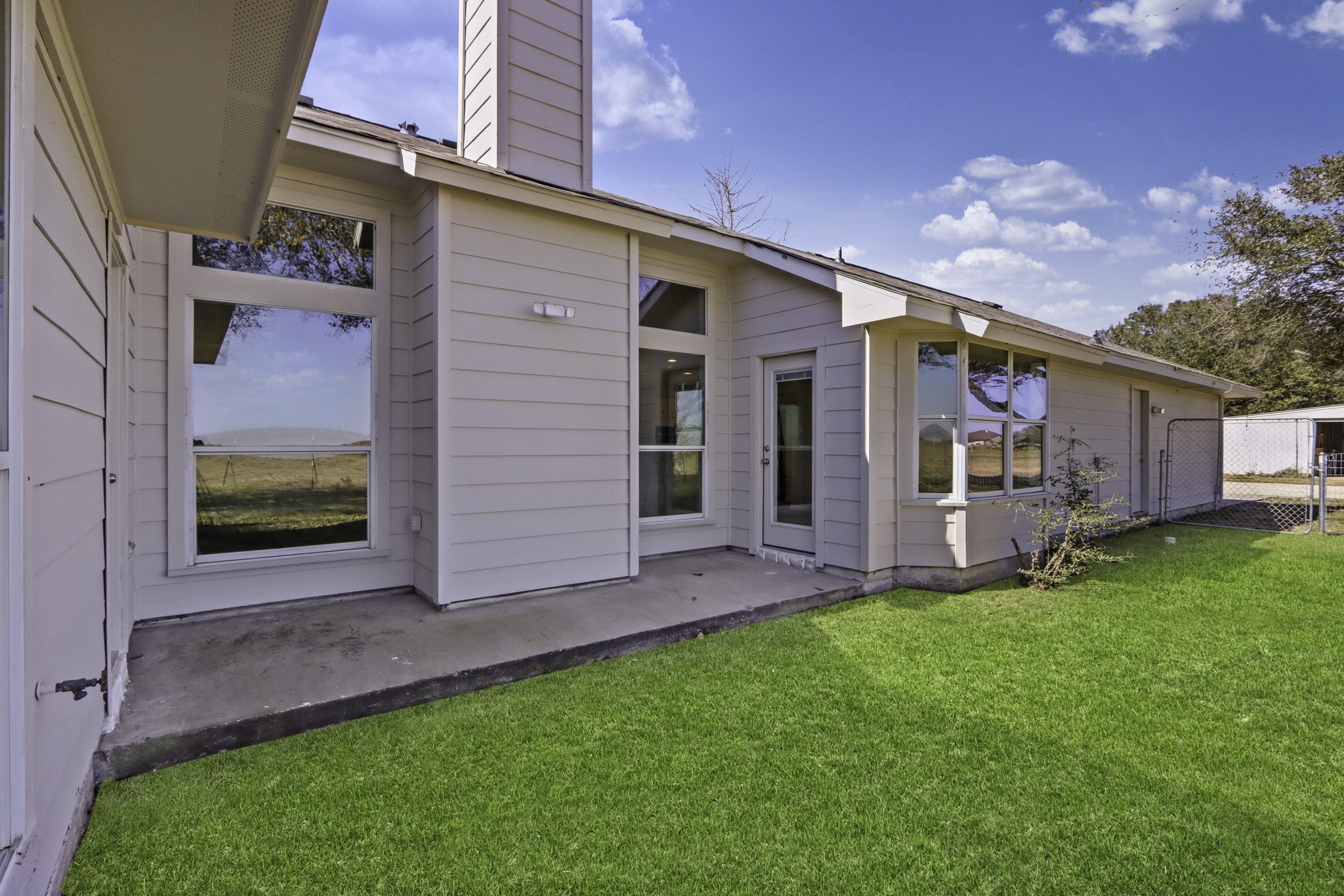 2445 Woods Road Brookshire, TX 77423 - Photo 25 of 29 a view of a house with a yard and sitting area