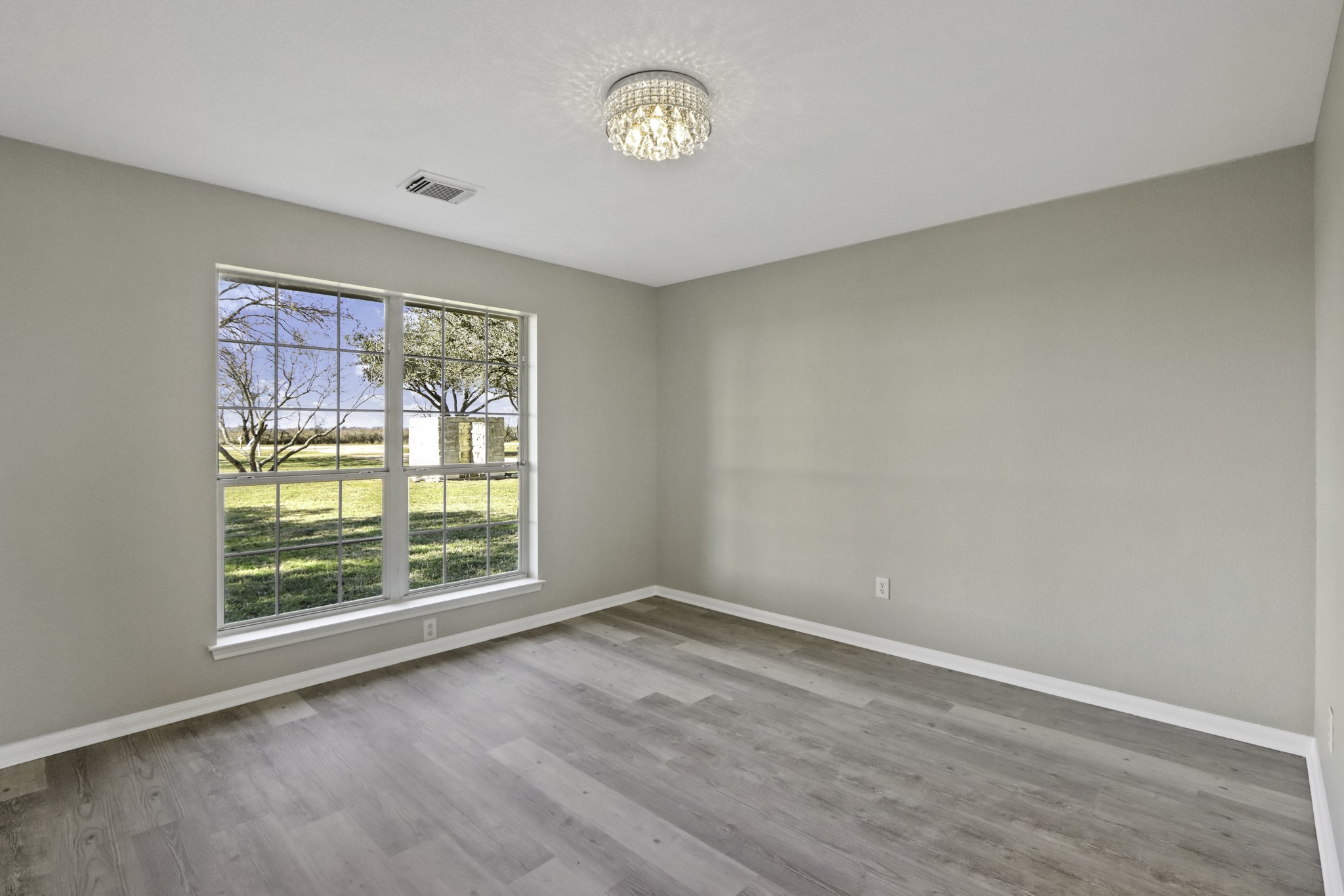 2445 Woods Road Brookshire, TX 77423 - Photo 5 of 29 an empty room with a window