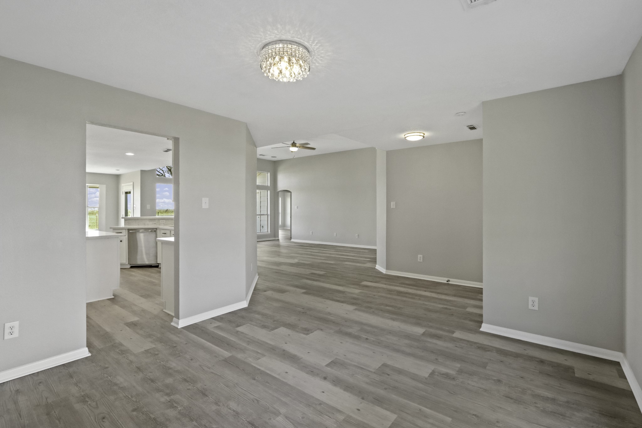 2445 Woods Road Brookshire, TX 77423 - Photo 6 of 29 a view of a big room with wooden floor and windows