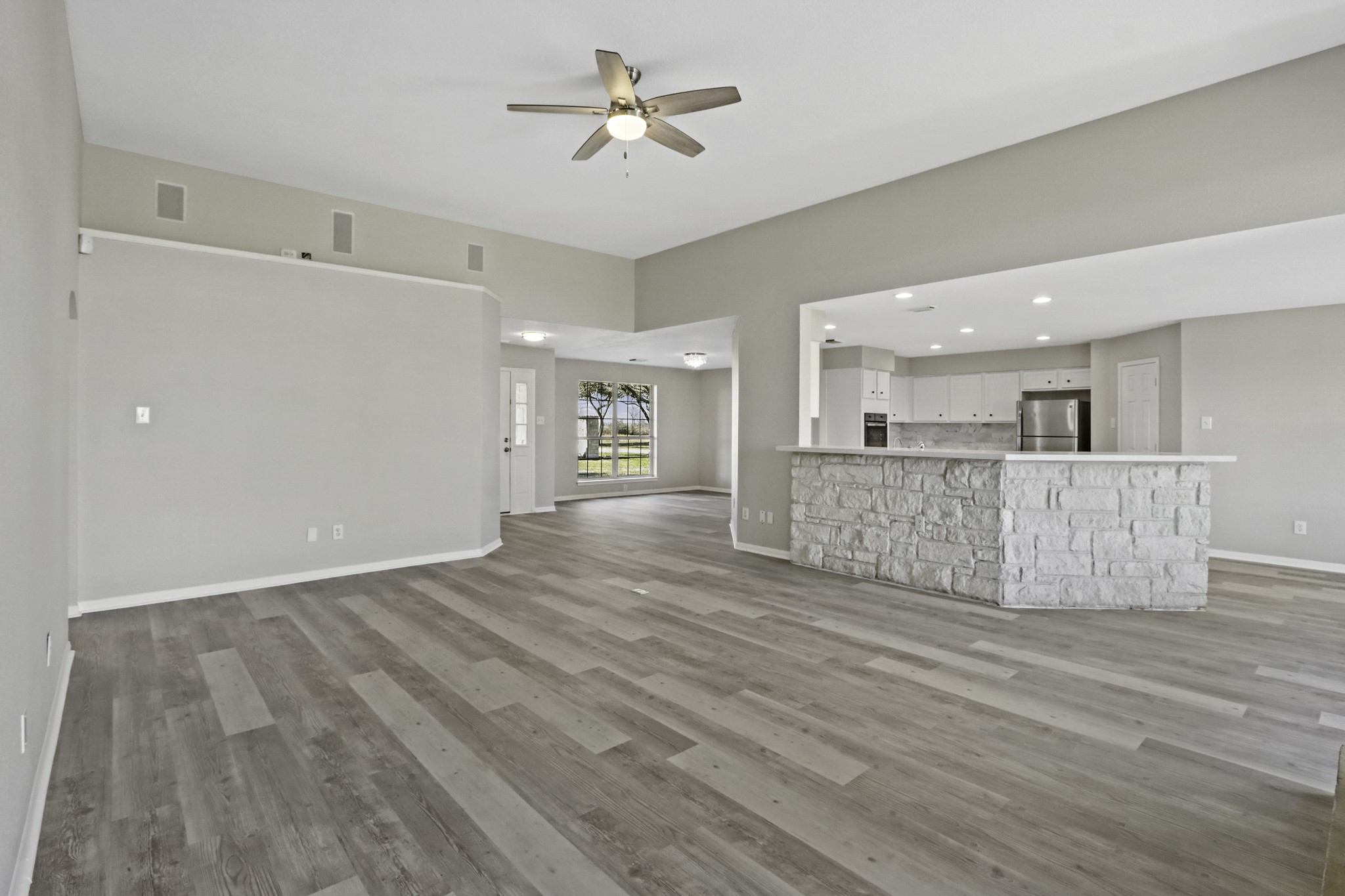 2445 Woods Road Brookshire, TX 77423 - Photo 29 of 29 a view of a livingroom with furniture wooden floor and a ceiling fan