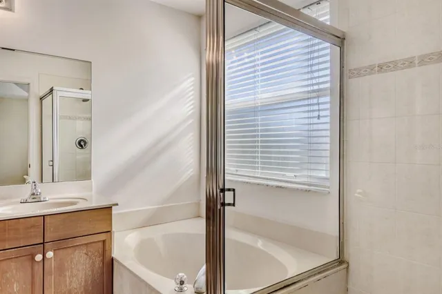 a bathroom with a bathtub and a sink