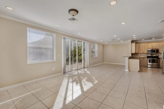 a view of kitchen with furniture and large window