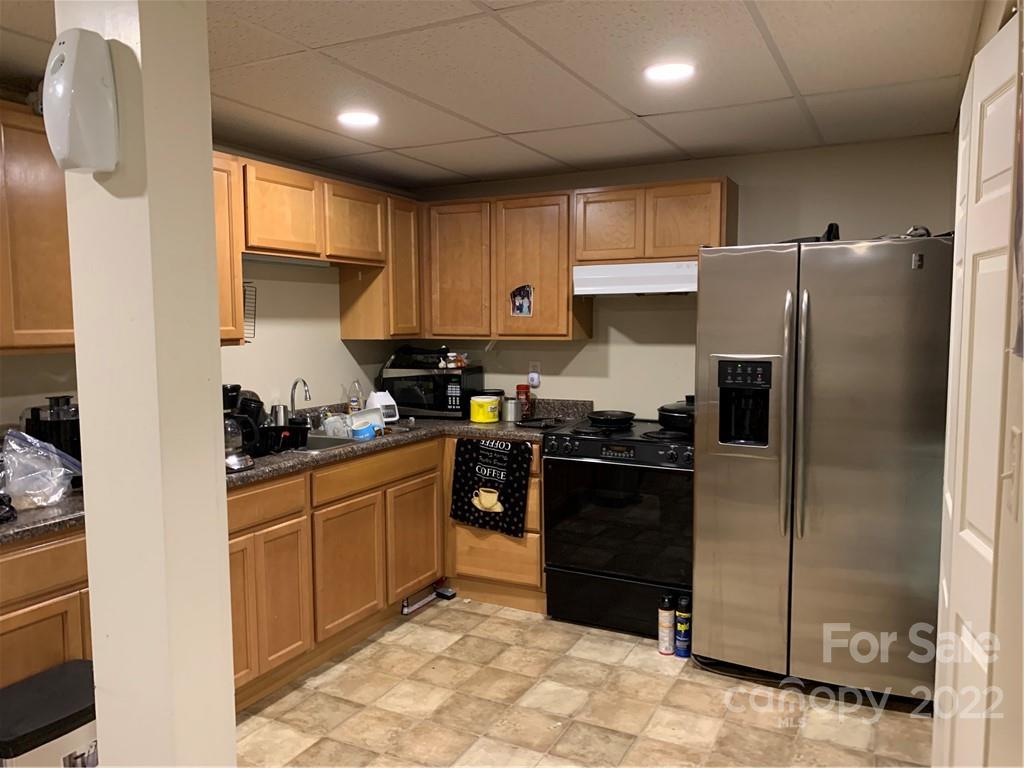 368 Hidden Hill Road Tryon, NC 28782 - Photo 13 of 19 a kitchen with stainless steel appliances granite countertop a refrigerator and a sink