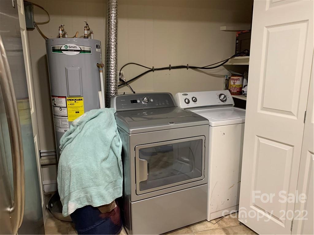 368 Hidden Hill Road Tryon, NC 28782 - Photo 14 of 19 a utility room with dryer and washer