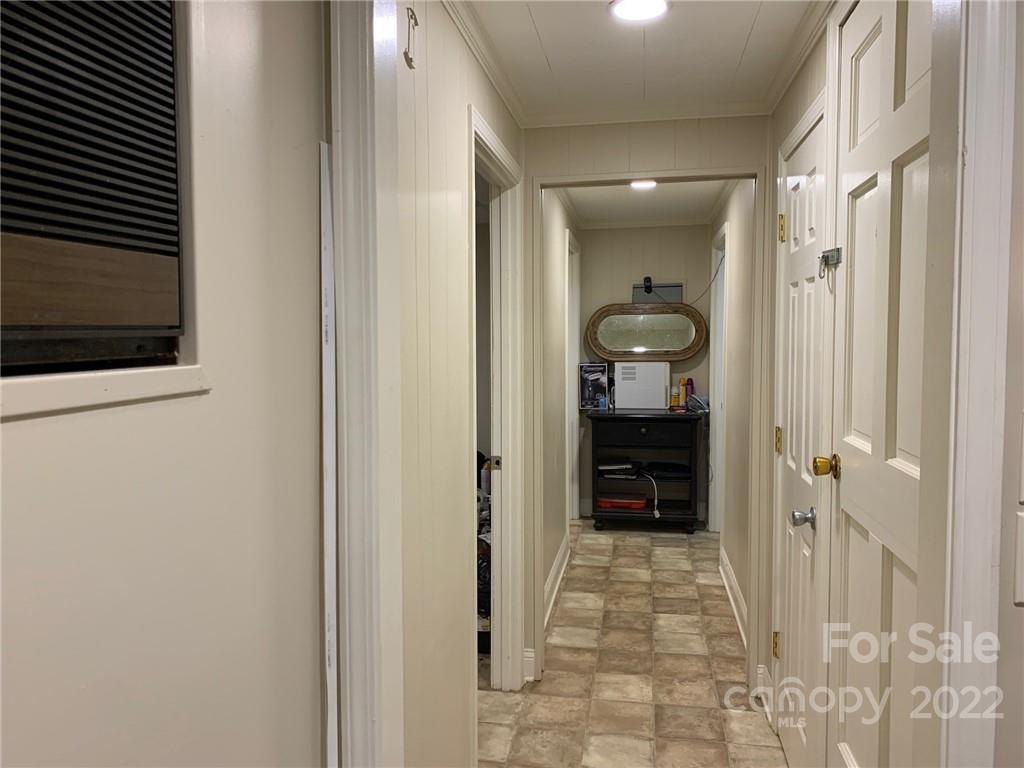 368 Hidden Hill Road Tryon, NC 28782 - Photo 15 of 19 a view of a hallway with bathroom and a bathroom