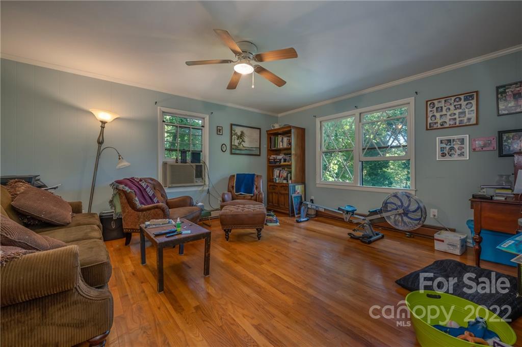 368 Hidden Hill Road Tryon, NC 28782 - Photo 5 of 19 a living room with furniture and a large window