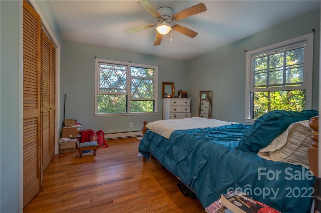 368 Hidden Hill Road Tryon, NC 28782 - Photo 8 of 19 a bedroom with a bed and window