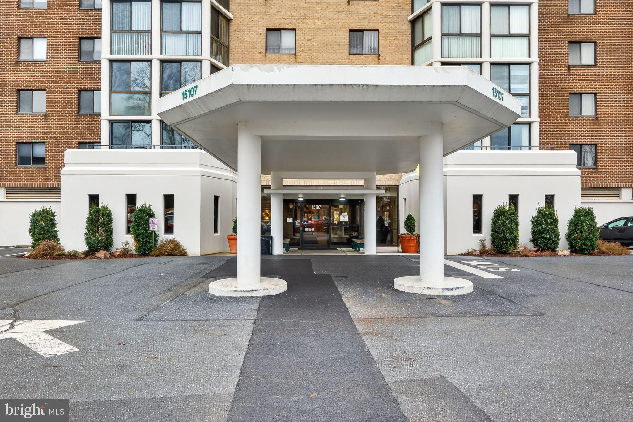 a view of white house with large windows