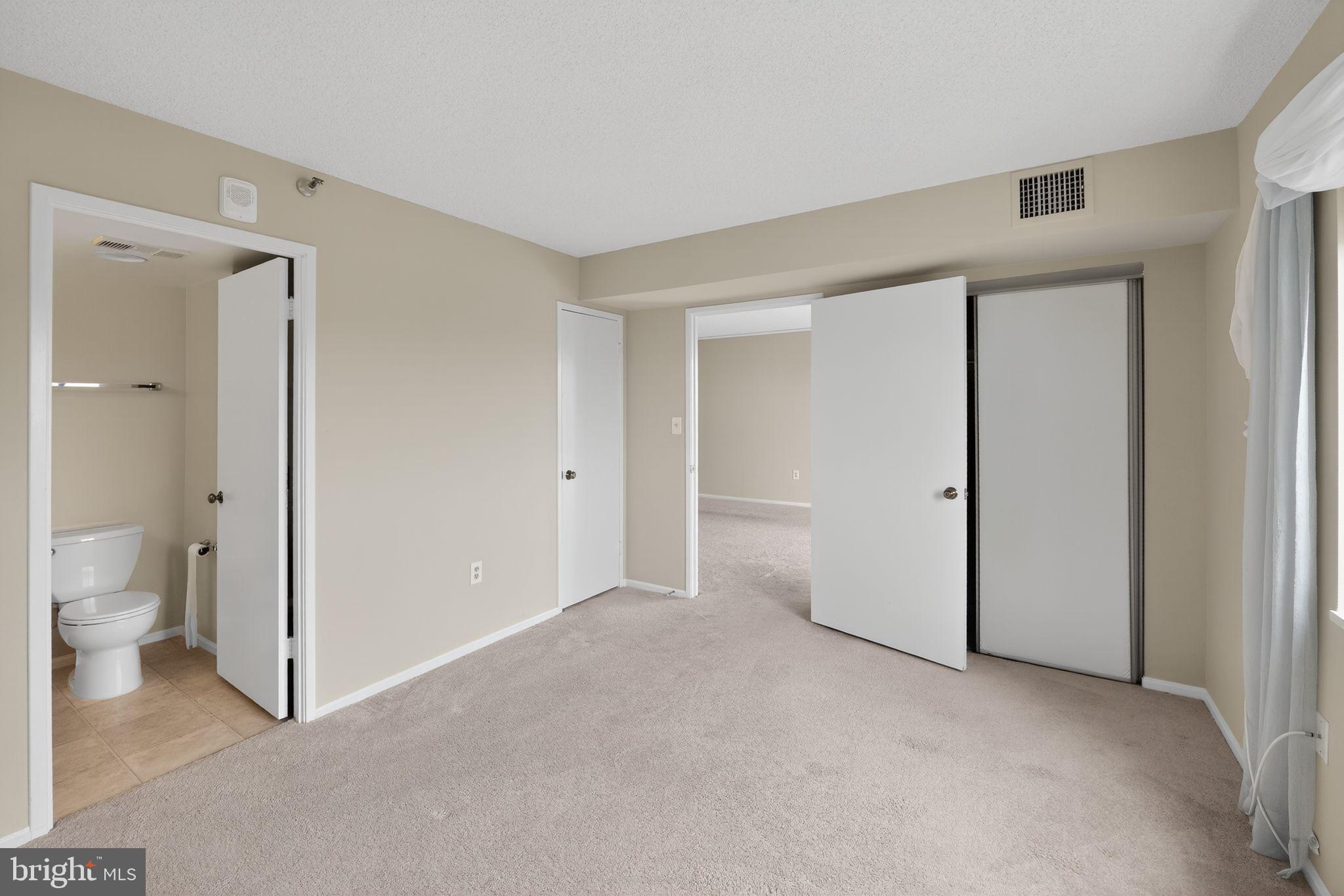 15107 Interlachen Drive, Unit 21022 Silver Spring, MD 20906 - Photo 17 of 33 a view of an empty room and a room