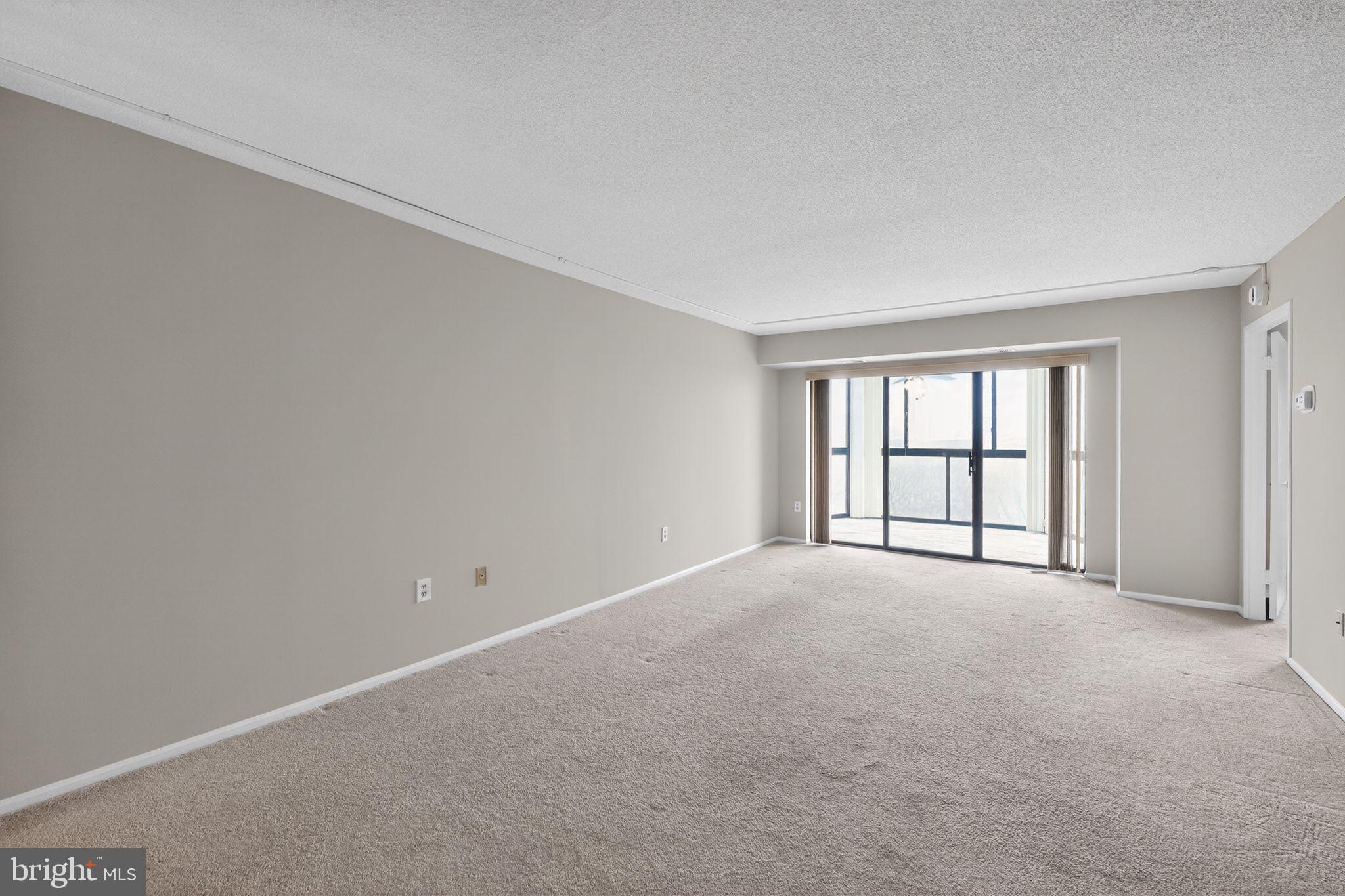 15107 Interlachen Drive, Unit 21022 Silver Spring, MD 20906 - Photo 18 of 33 an empty room with windows