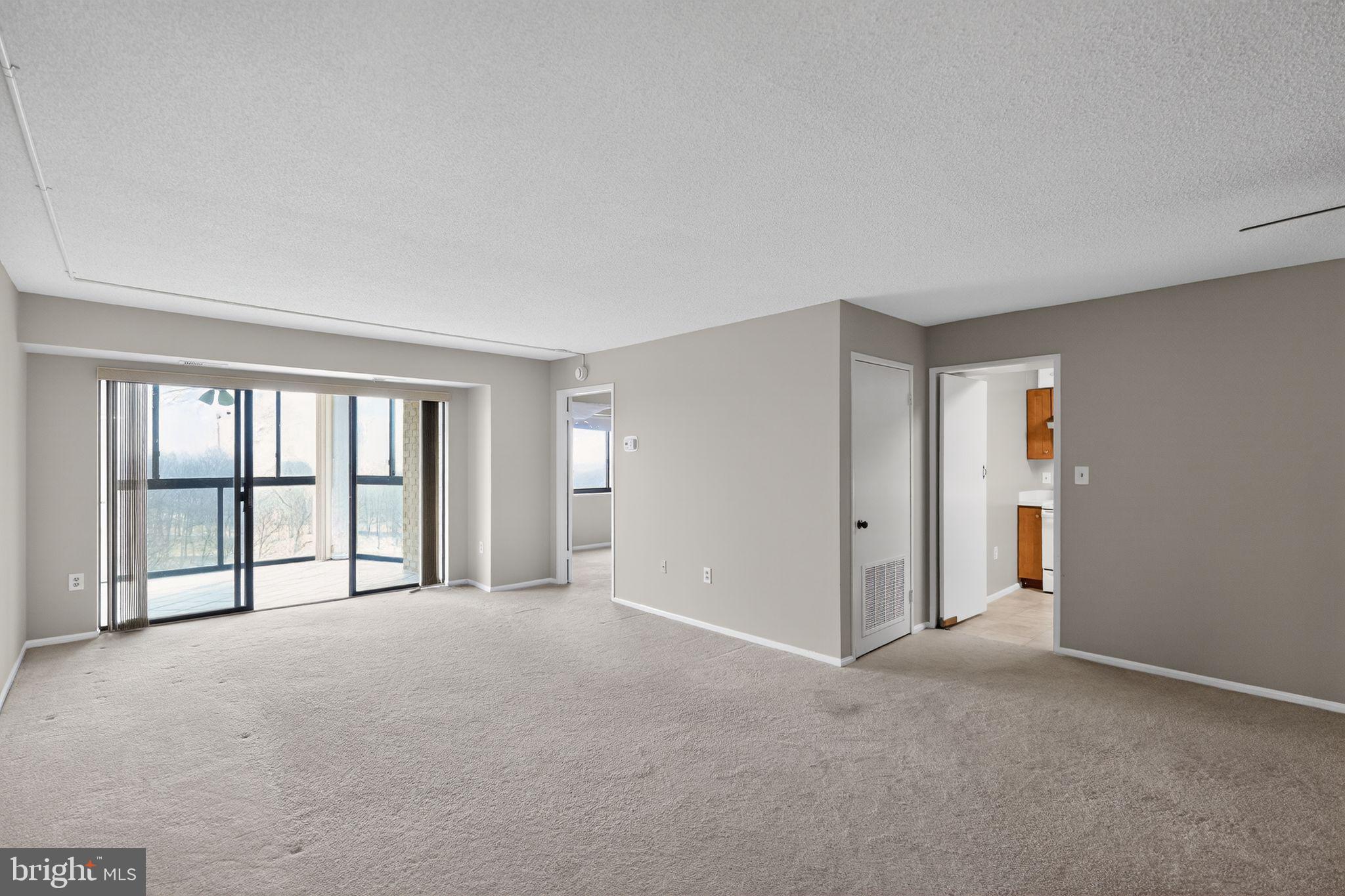 15107 Interlachen Drive, Unit 21022 Silver Spring, MD 20906 - Photo 19 of 33 a view of an empty room with a window