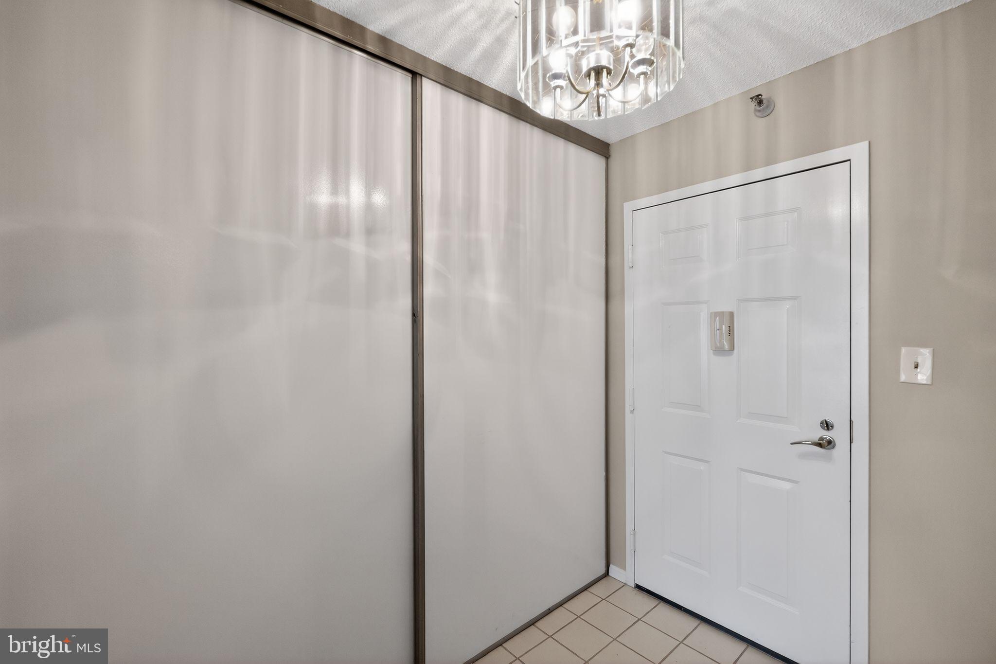 15107 Interlachen Drive, Unit 21022 Silver Spring, MD 20906 - Photo 28 of 33 a view of entryway with chandelier fan