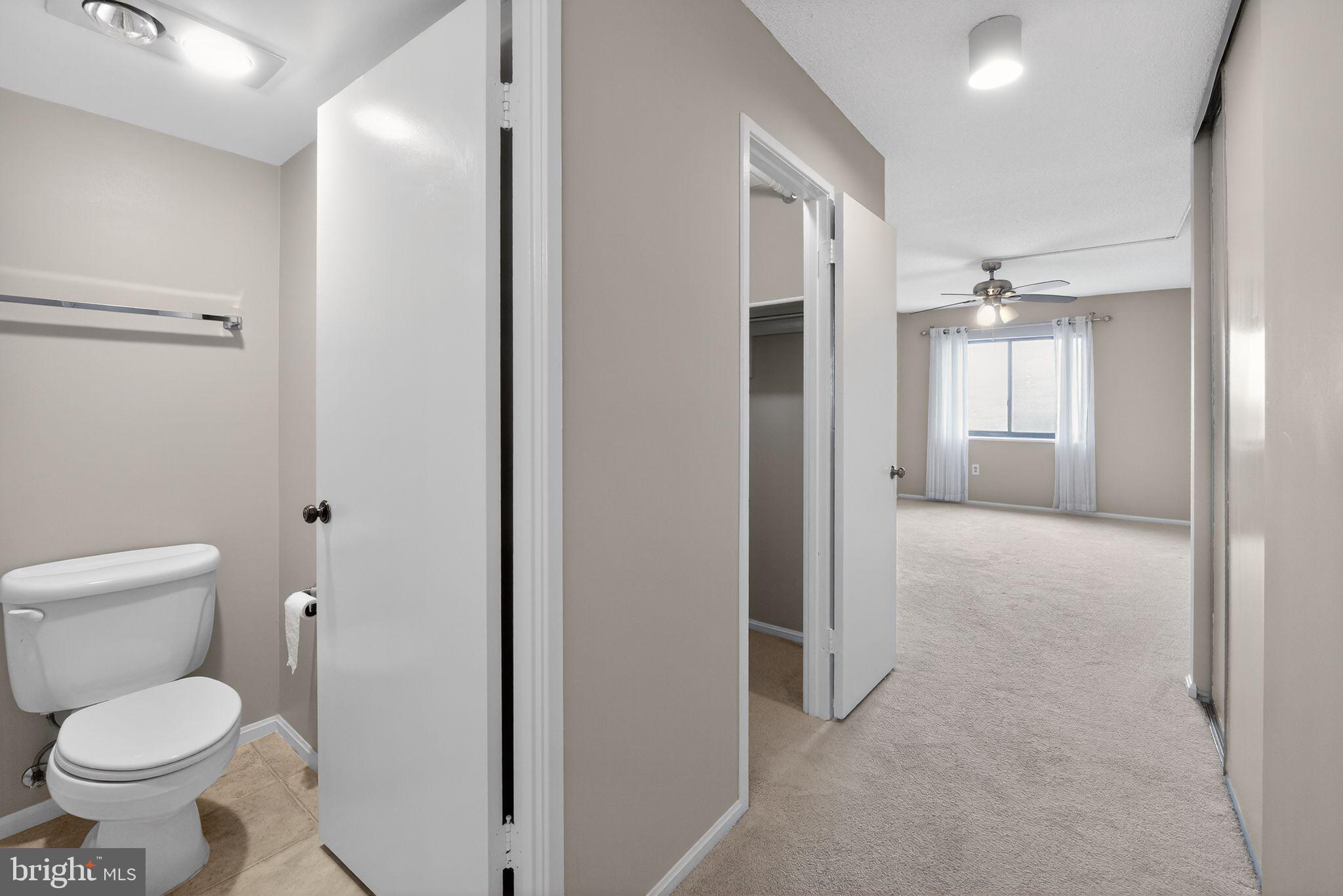 15107 Interlachen Drive, Unit 21022 Silver Spring, MD 20906 - Photo 29 of 33 a bathroom with a toilet and a shower