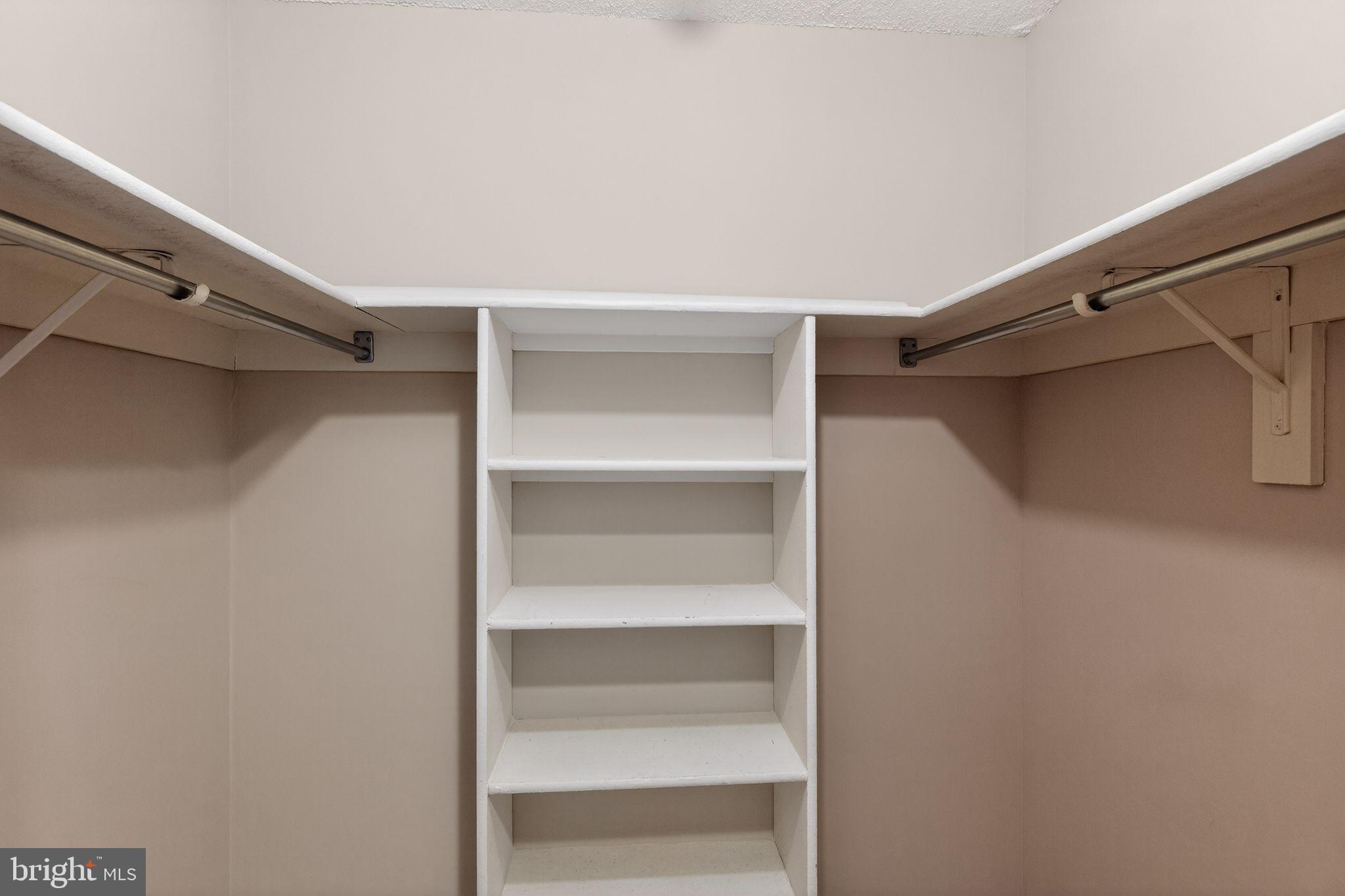 15107 Interlachen Drive, Unit 21022 Silver Spring, MD 20906 - Photo 33 of 33 a view of walk in closet with empty racks