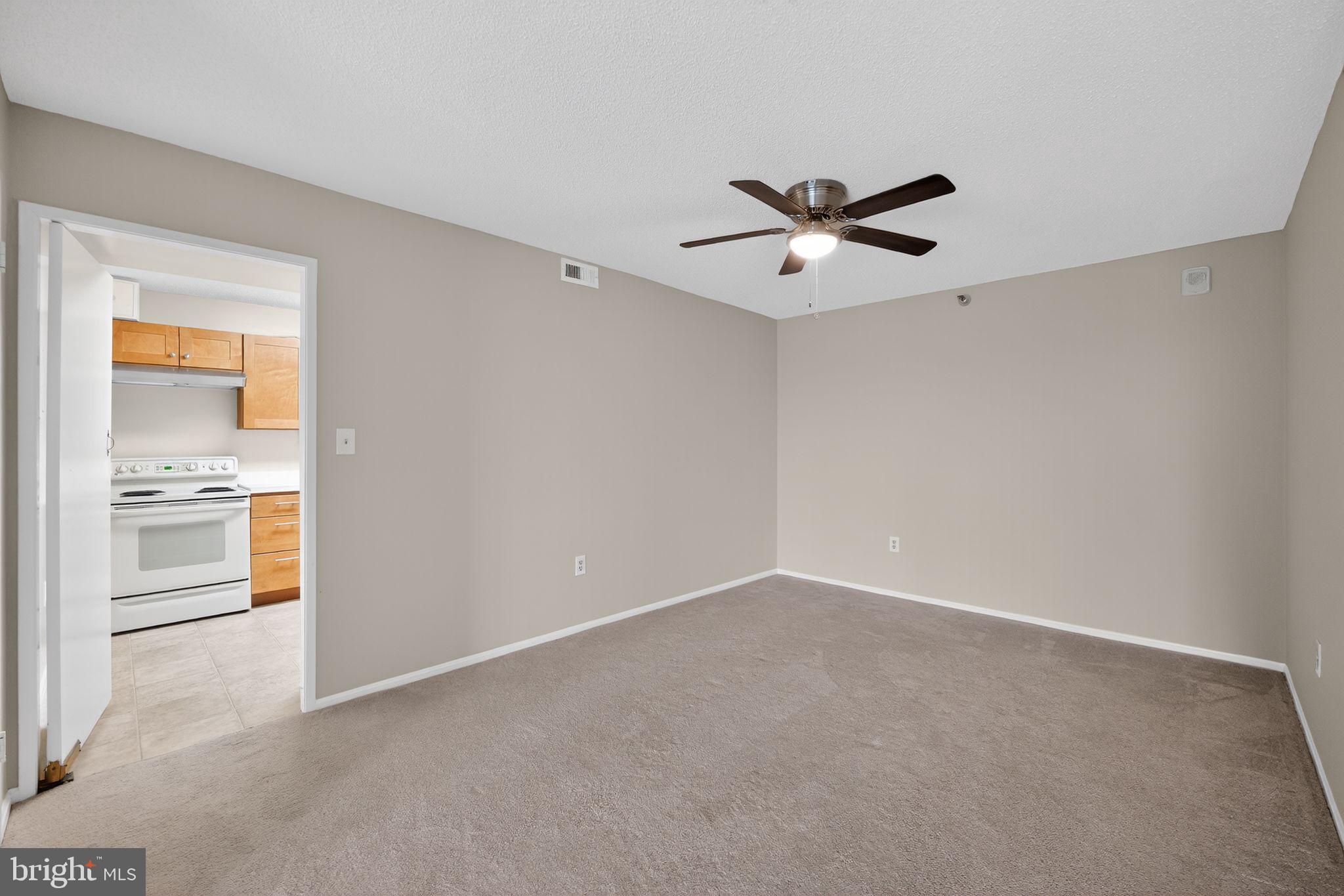 15107 Interlachen Drive, Unit 21022 Silver Spring, MD 20906 - Photo 7 of 33 a view of an empty room with a window
