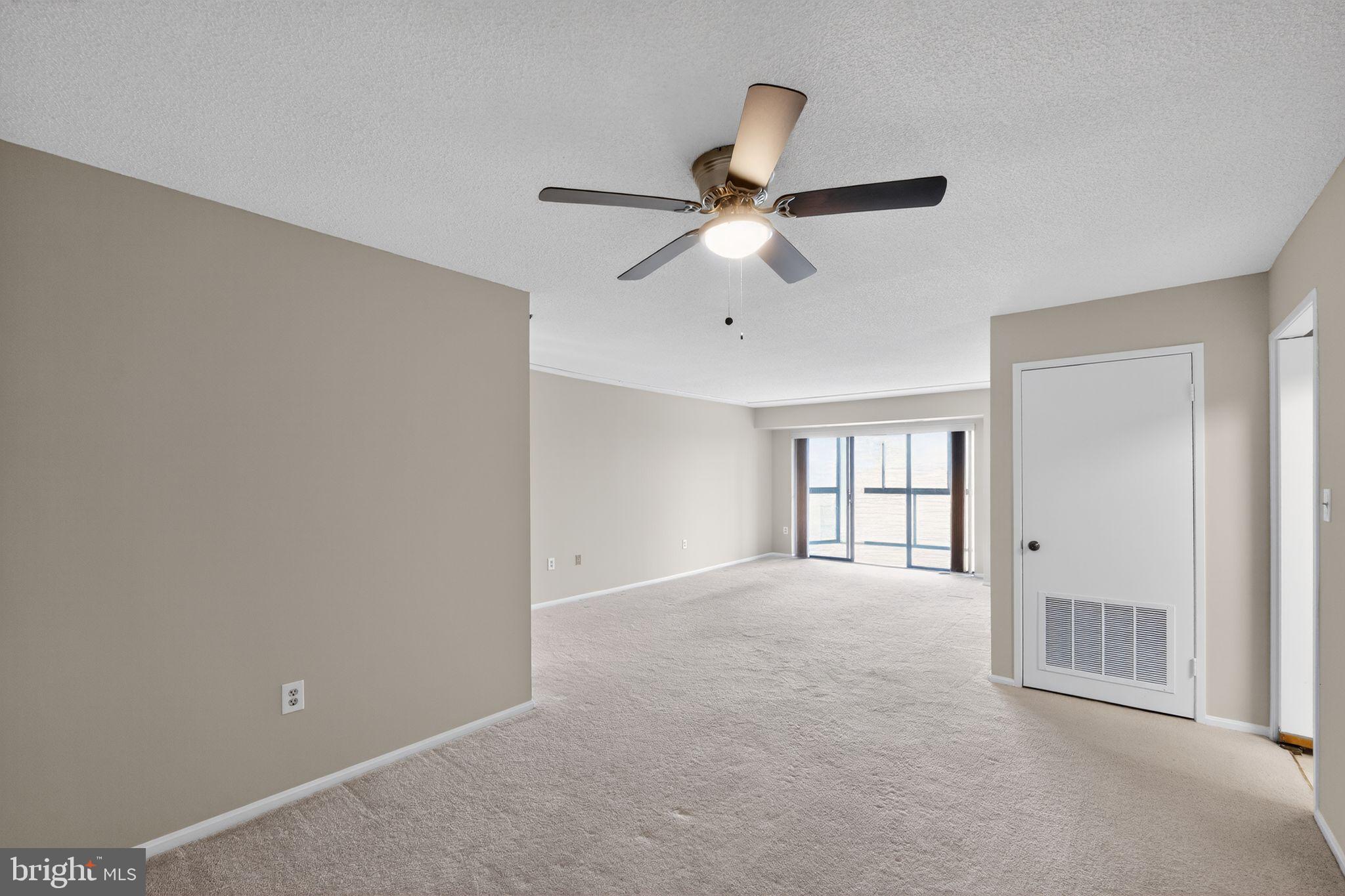15107 Interlachen Drive, Unit 21022 Silver Spring, MD 20906 - Photo 8 of 33 a view of an empty room with a window