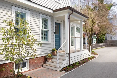 a front view of a house with a porch