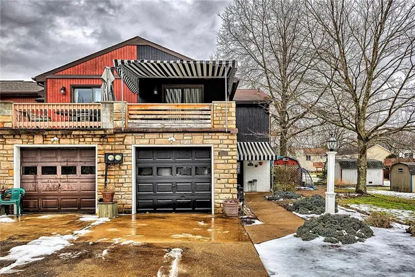 a front view of a house with a garage