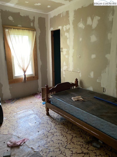 746 Bear Wallow Road Lansing, NC 28643 - Photo 32 of 42 a room with a bed and a window