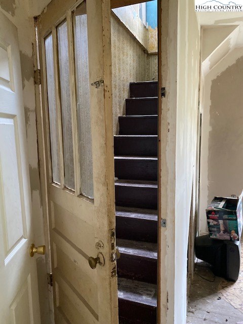 746 Bear Wallow Road Lansing, NC 28643 - Photo 33 of 42 a view of closet with stairs