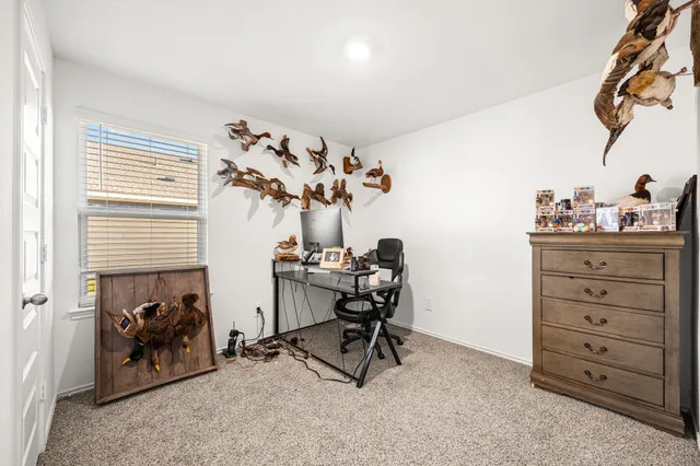 a view of a workspace with furniture