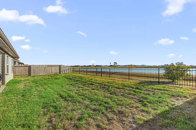 a view of a golf course with a lake view