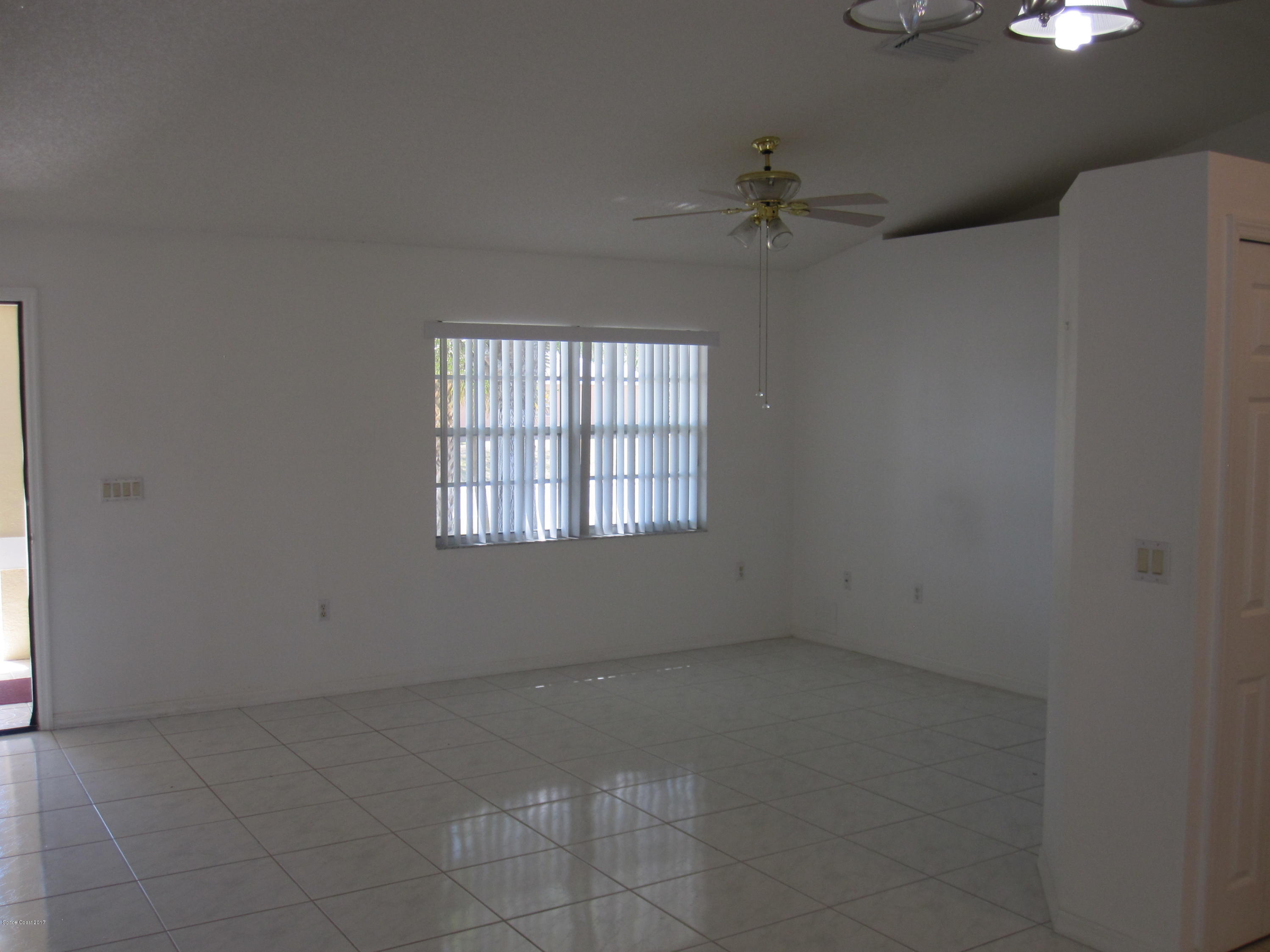 171 Americana Boulevard Northeast Palm Bay, FL 32907 - Photo 6 of 17 an empty room with a window