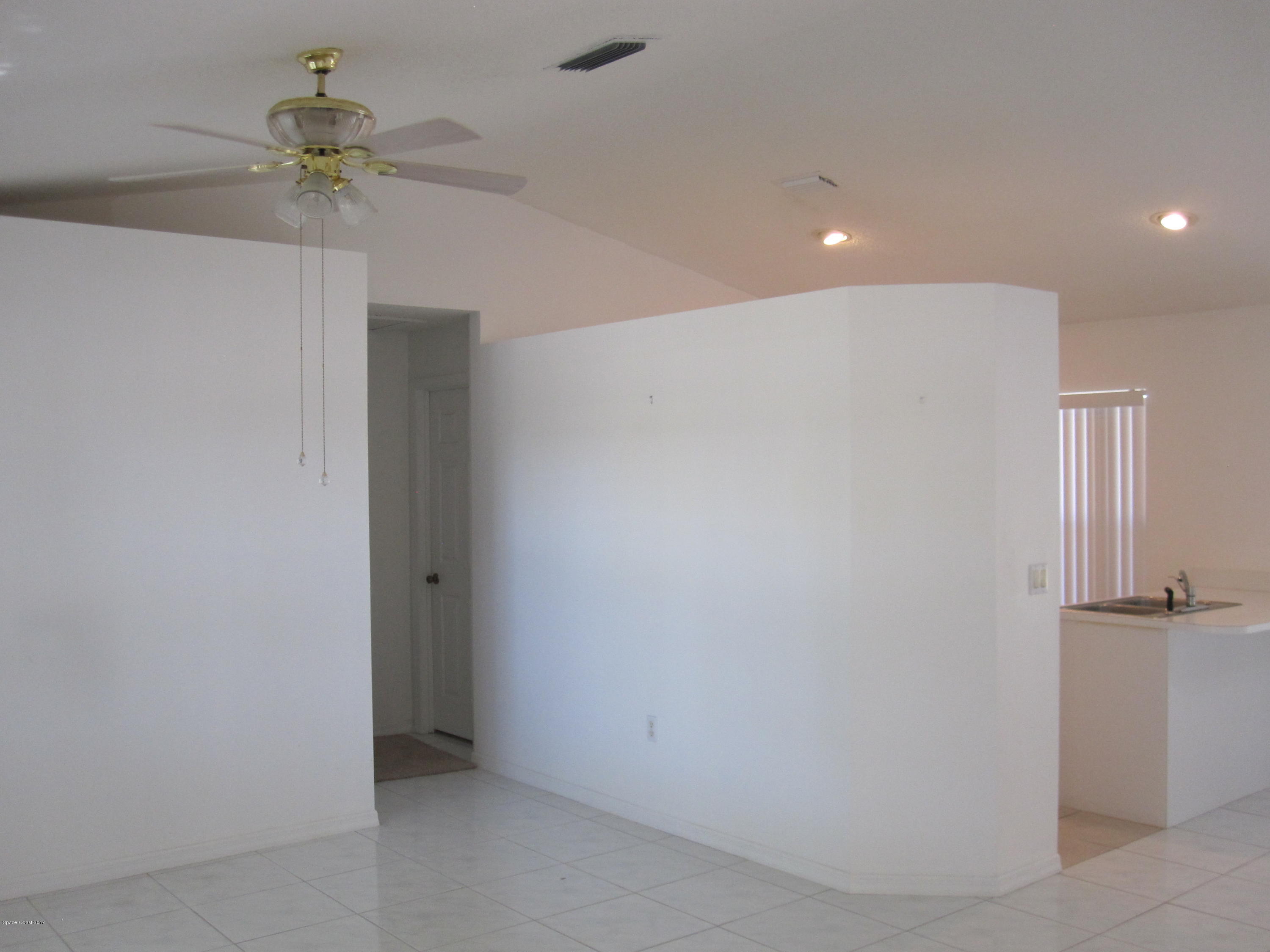 171 Americana Boulevard Northeast Palm Bay, FL 32907 - Photo 9 of 17 a view of a chandelier fan