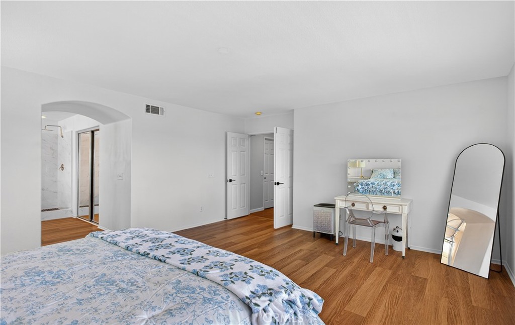 31928 Cercle Chambertin Temecula, CA 92591 - Photo 37 of 74 a bedroom with a bed and wooden floor