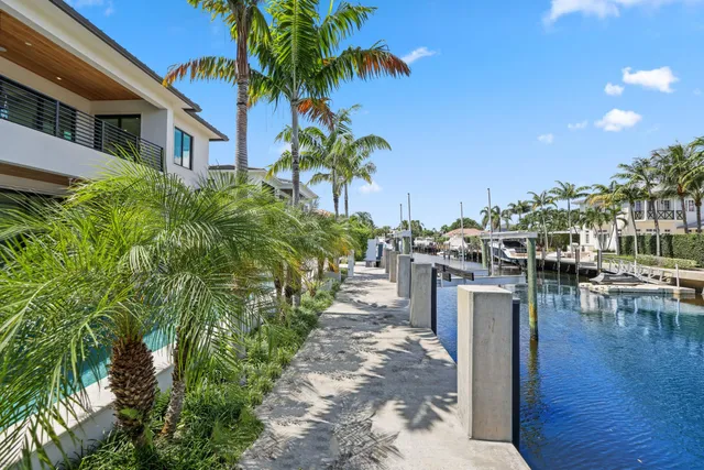 a spacious bedroom with a large bed and large window