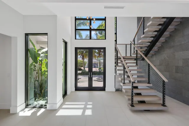 a bathroom with a double vanity sink a mirror and bathtub