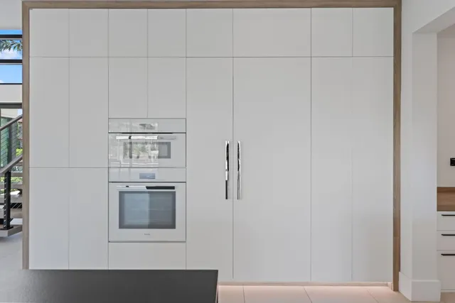 an aerial view of multiple houses with yard