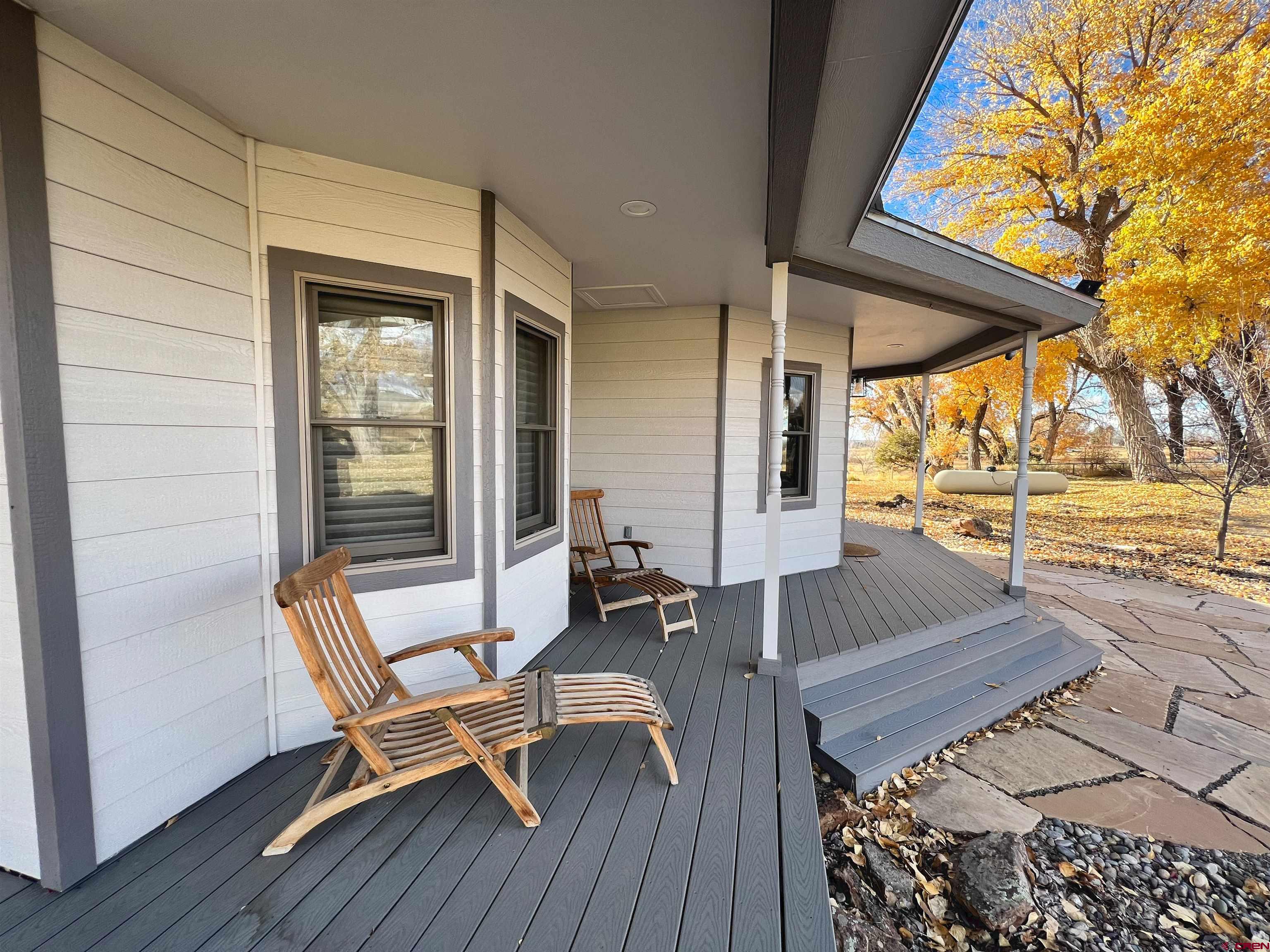25286 Rd T.5 Dolores, CO 81323 - Photo 11 of 44 a view of a patio with chair and wooden floor