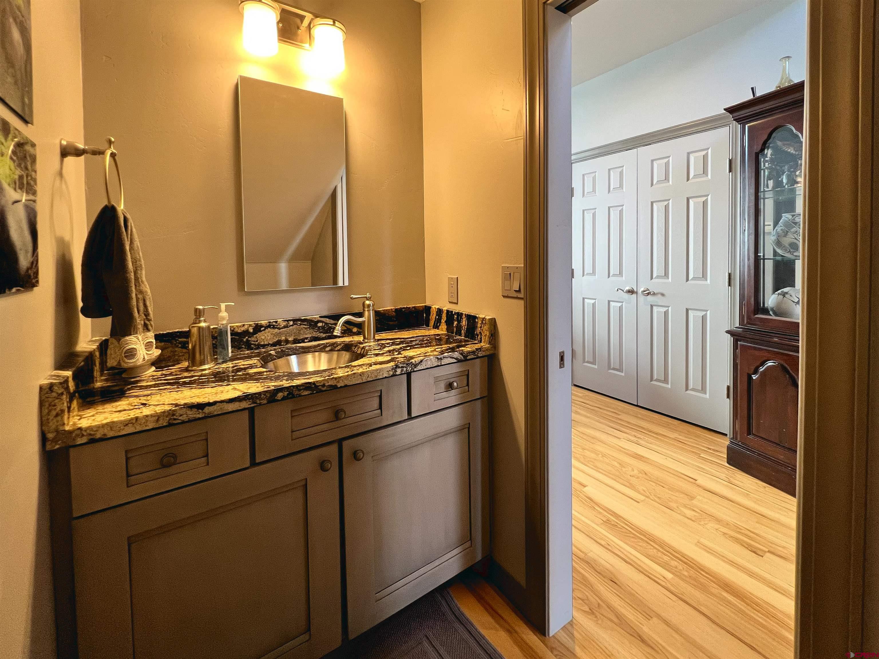 25286 Rd T.5 Dolores, CO 81323 - Photo 24 of 44 a kitchen with a sink and a mirror