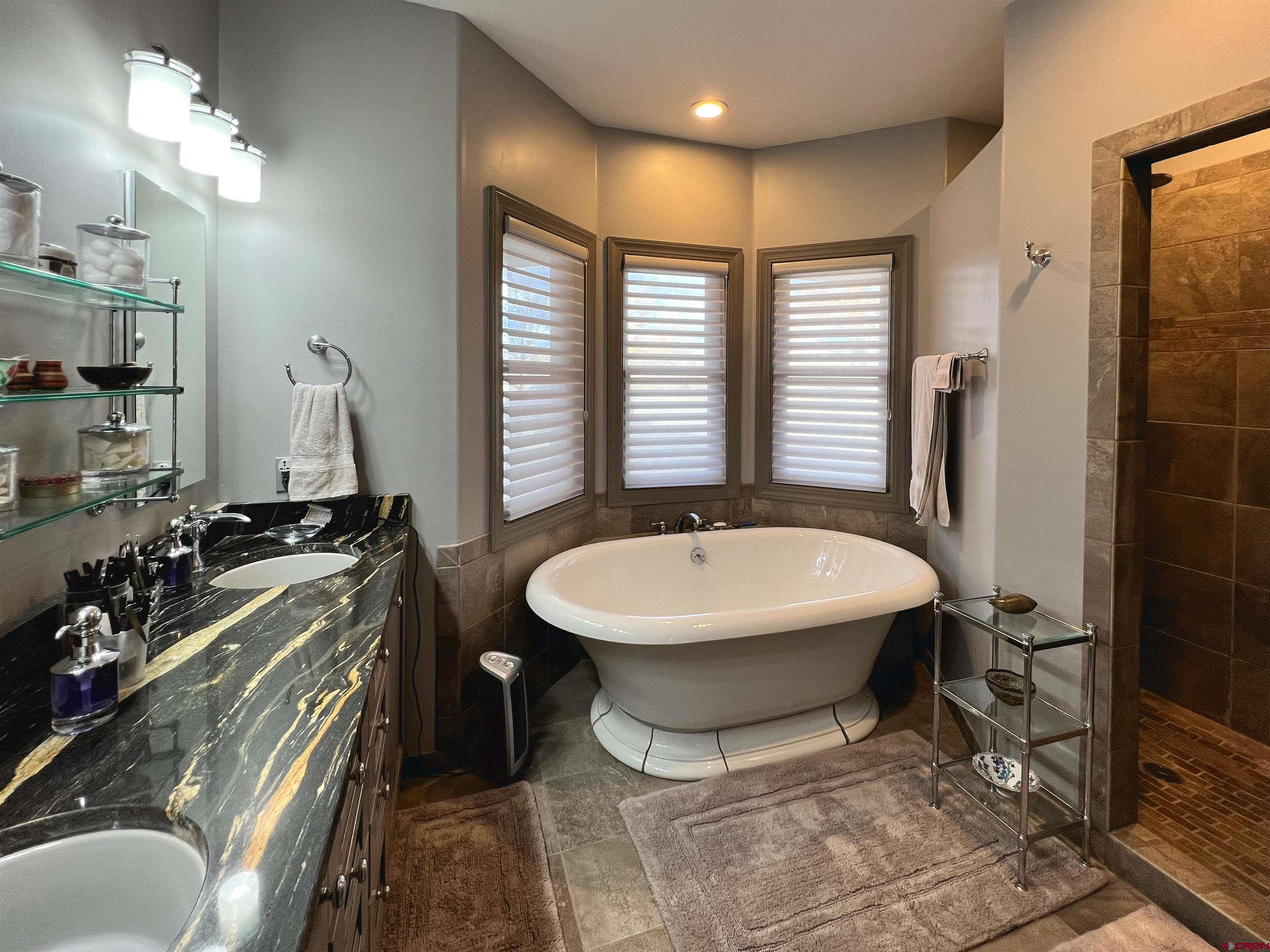 25286 Rd T.5 Dolores, CO 81323 - Photo 26 of 44 a bathroom with a sink and a mirror