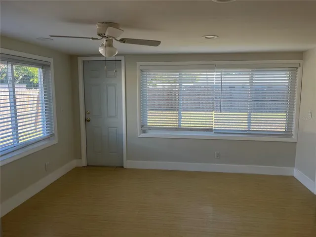 a view of an empty room with a window