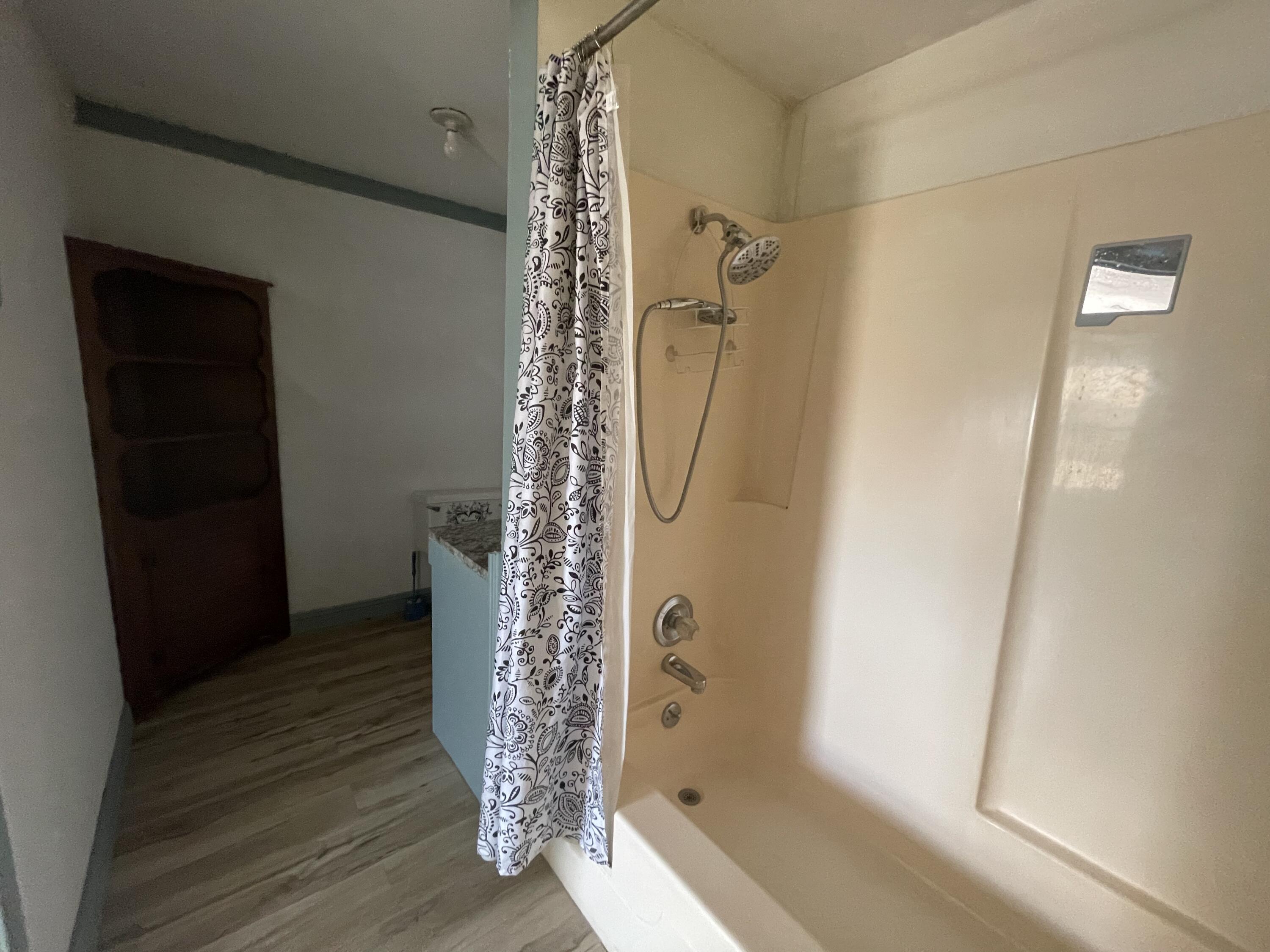 325 South 13th Street Slaton, TX 79364 - Photo 12 of 35 a bathroom with a shower