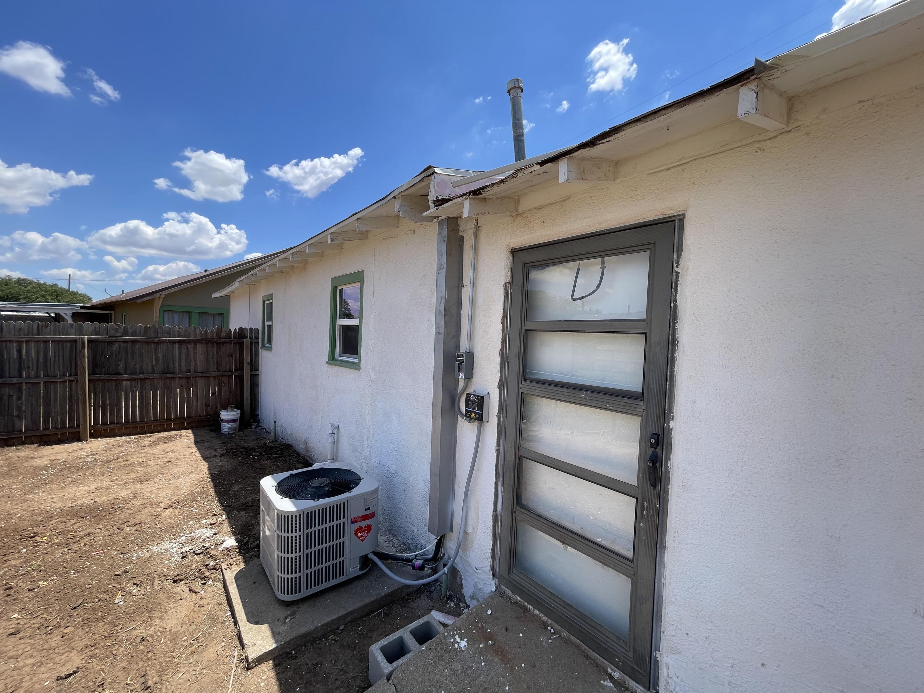 325 South 13th Street Slaton, TX 79364 - Photo 15 of 35 a front view of a house with chairs