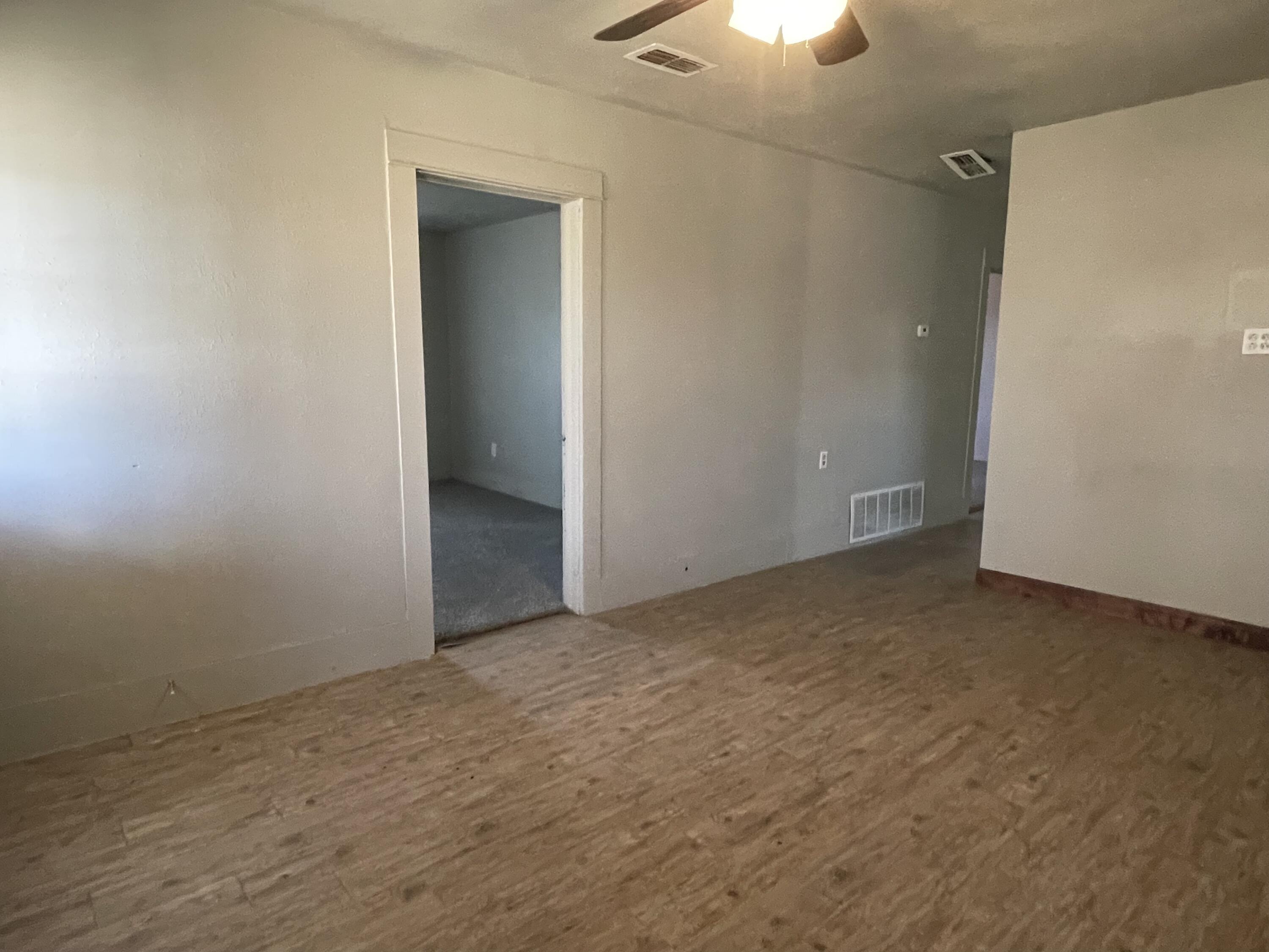 325 South 13th Street Slaton, TX 79364 - Photo 21 of 35 an empty room with a empty space