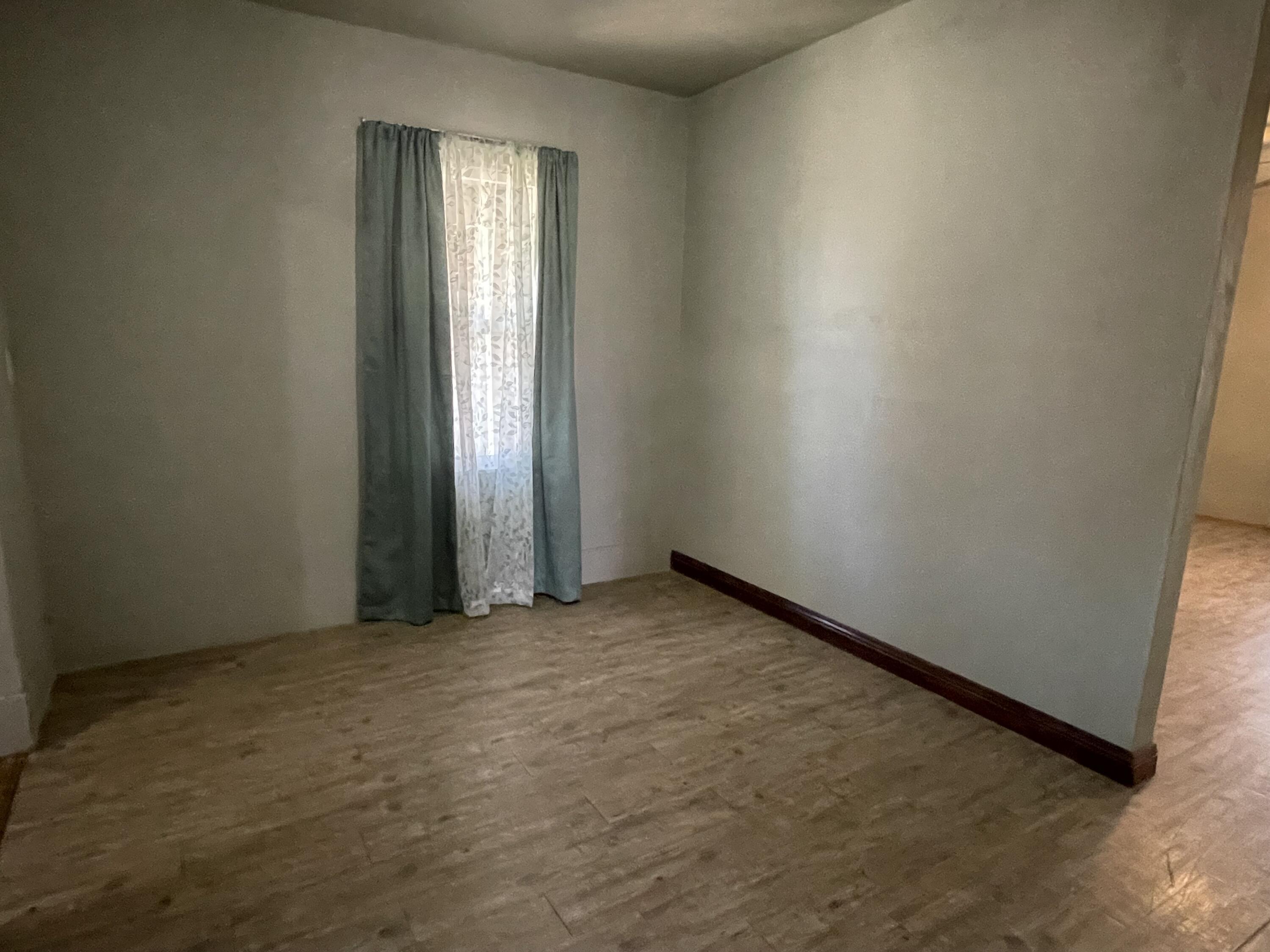 325 South 13th Street Slaton, TX 79364 - Photo 23 of 35 an empty room with windows